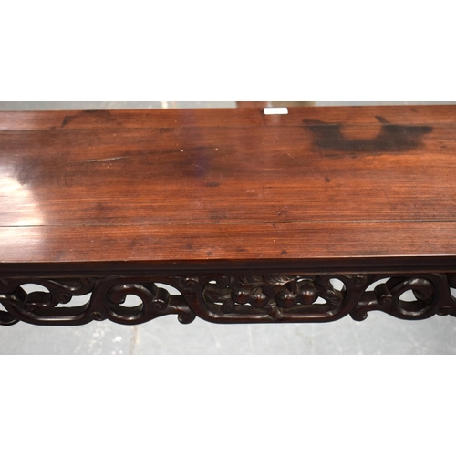 673 - A LARGE 19TH CENTURY CHINESE CARVED HARDWOOD ALTAR TABLE Qing. 210 cm x 105 cm x 48 cm.