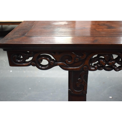 673 - A LARGE 19TH CENTURY CHINESE CARVED HARDWOOD ALTAR TABLE Qing. 210 cm x 105 cm x 48 cm.