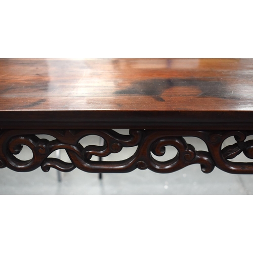 673 - A LARGE 19TH CENTURY CHINESE CARVED HARDWOOD ALTAR TABLE Qing. 210 cm x 105 cm x 48 cm.