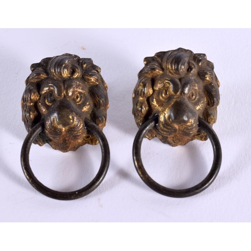 675D - A PAIR OF GEORGE III LION MASK HEADS. 2.5 cm wide.