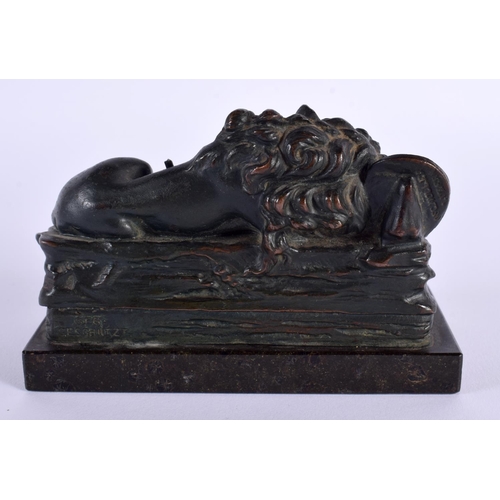 680D - A 19TH CENTURY EUROPEAN GRAND TOUR BRONZE FIGURE OF A LION with central inscription. 12 cm x 9 cm.