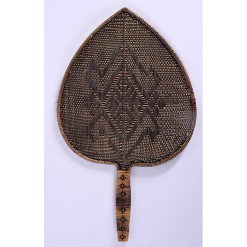 680B - AN UNUSUAL VINTAGE TRIBAL WICKER FAN. 26 cm x 18 cm.