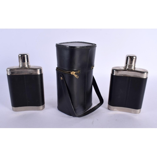 684 - A LEATHER CASED GENTLEMANS DOUBLE HIP FLASK. 18 cm x 8 cm.