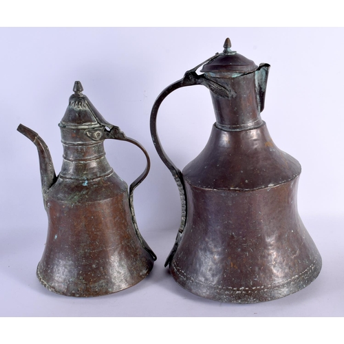 687 - A LARGE 18TH/19TH CENTURY MIDDLE EASTERN HEAVY TINNED COPPER EWERS. Largest 42 cm x 18 cm. (2)