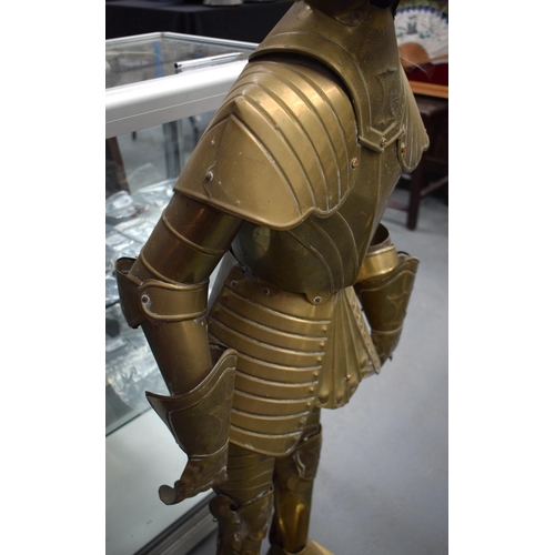 697 - AN UNUSUAL EARLY 20TH CENTURY EUROPEAN BRASS CHILD SIZE SUIT OF ARMOUR. 125 cm high.