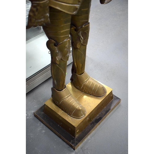 697 - AN UNUSUAL EARLY 20TH CENTURY EUROPEAN BRASS CHILD SIZE SUIT OF ARMOUR. 125 cm high.