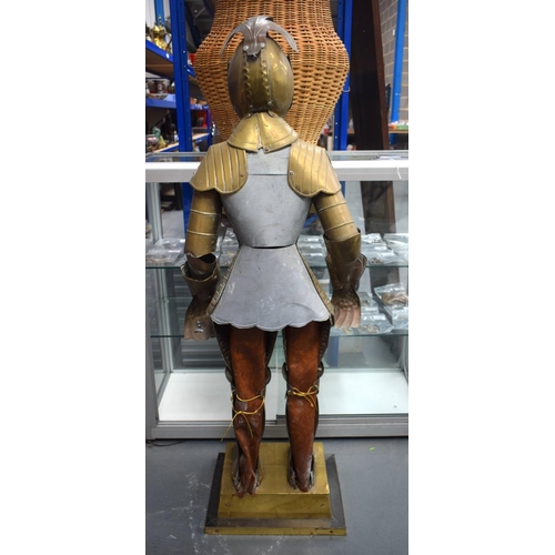 697 - AN UNUSUAL EARLY 20TH CENTURY EUROPEAN BRASS CHILD SIZE SUIT OF ARMOUR. 125 cm high.