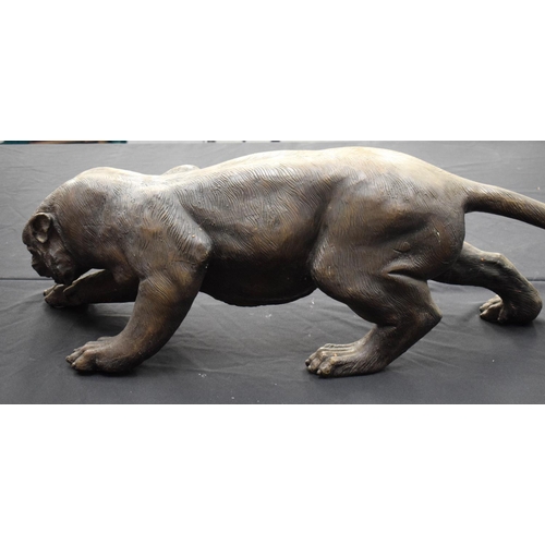 699 - A LARGE CONTEMPORARY BRONZE FIGURE OF A PANTHER modelled in a roaming stance. 100 cm x 30 cm.