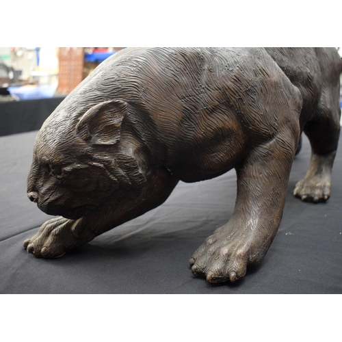 699 - A LARGE CONTEMPORARY BRONZE FIGURE OF A PANTHER modelled in a roaming stance. 100 cm x 30 cm.