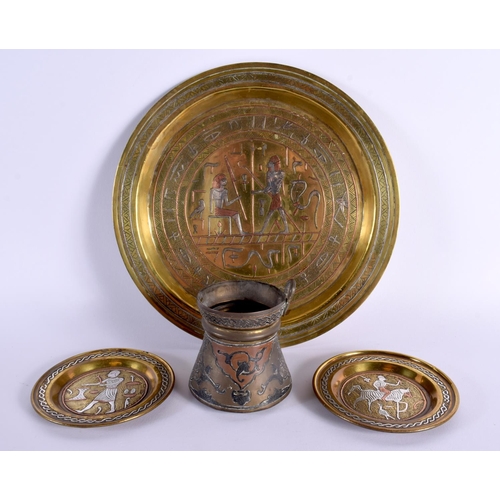 700E - A GROUP OF ANTIQUE MIDDLE EASTERN CAIRO WARE SILVER INLAID WARES. Largest 25 cm diameter. (4)