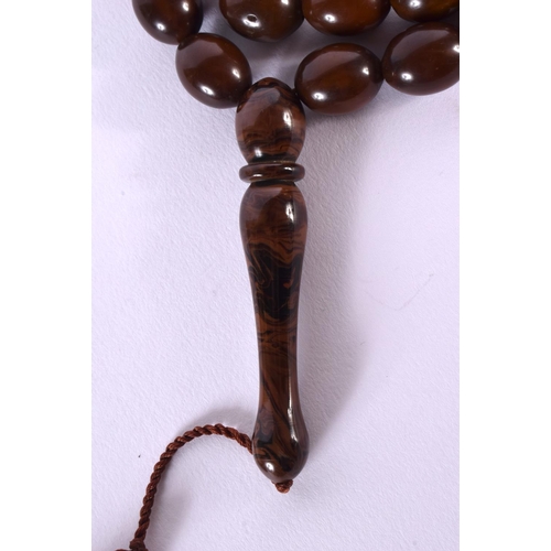 705B - A STRING OF MIDDLE EASTERN ISLAMIC RELIGIOUS BEADS. 160 cm long.