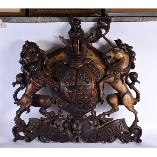 705D - A LARGE ANTIQUE COUNTRY HOUSE ARMORIAL CARVED WOOD COAT OF ARMS. 80 cm x 75 cm.