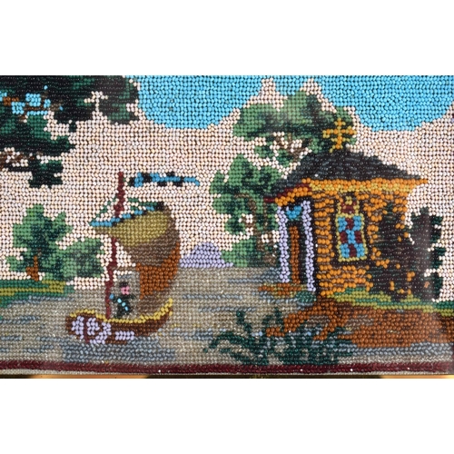 706 - A PAIR OF VICTORIAN BEAD WORK PICTURES within eglomise type glass surrounds. 30 cm x 24 cm.