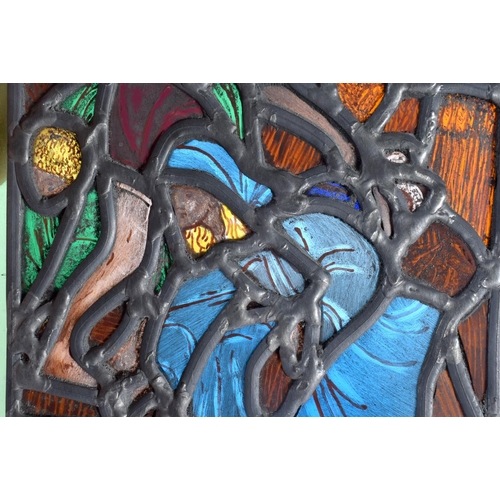 708 - AN UNUSUAL STAINED GLASS WINDOW depicting figures in erotic pursuits. 26 cm x 18 cm.