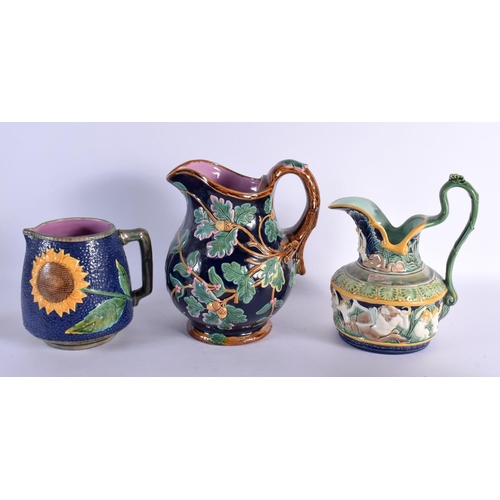 71 - THREE LARGE MAJOLICA JUGS. Largest 25 cm x 18 cm. (3)