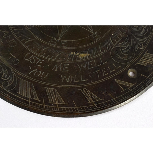 715A - A BRONZE SUNDIAL. 15 cm diameter.