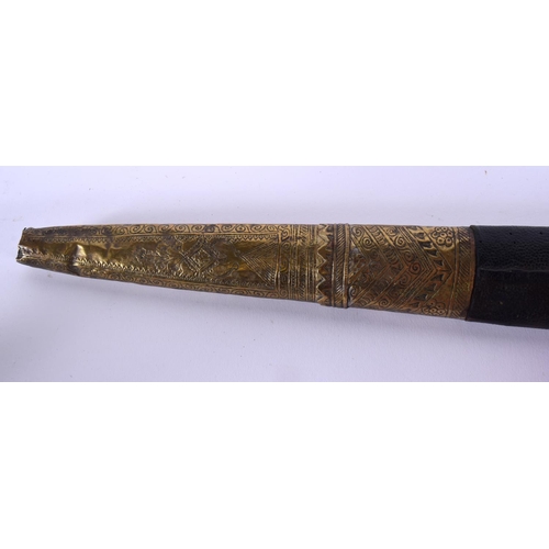 721B - A 19TH CENTURY MIDDLE EASTERN CARVED RHINOCEROS HORN SWORD. 77 cm long.