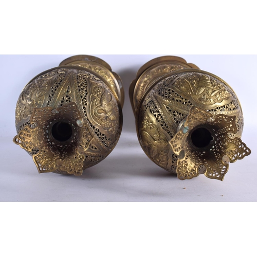 722 - A GOOD LARGE PAIR OF 19TH CENTURY MIDDLE EASTERN BRASS AND BRONZE LAMPS decorated with animals and k... 