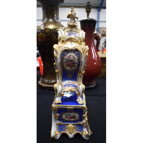 723A - A 19TH CENTURY FRENCH JABOB PETIT TYPE PORCELAIN CLOCK ON STAND. 40 cm x 15 cm.