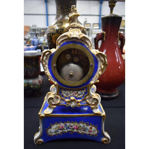 723A - A 19TH CENTURY FRENCH JABOB PETIT TYPE PORCELAIN CLOCK ON STAND. 40 cm x 15 cm.