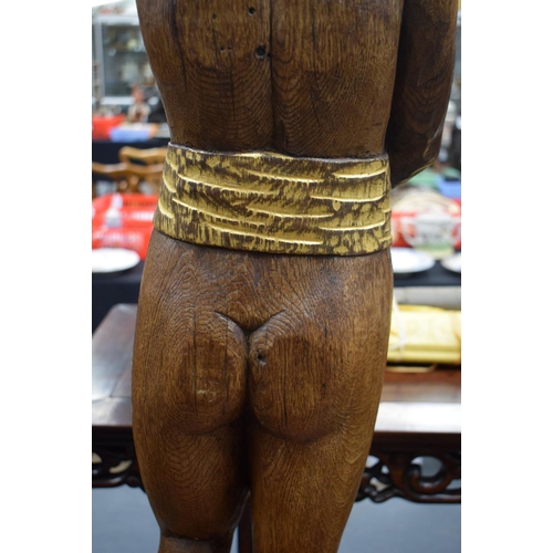 723E - A LARGE 1930S CARVED AND PAINTED OAK FIGURE possibly from a fair ground. 100 cm x 15 cm.