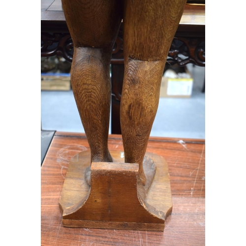 723E - A LARGE 1930S CARVED AND PAINTED OAK FIGURE possibly from a fair ground. 100 cm x 15 cm.