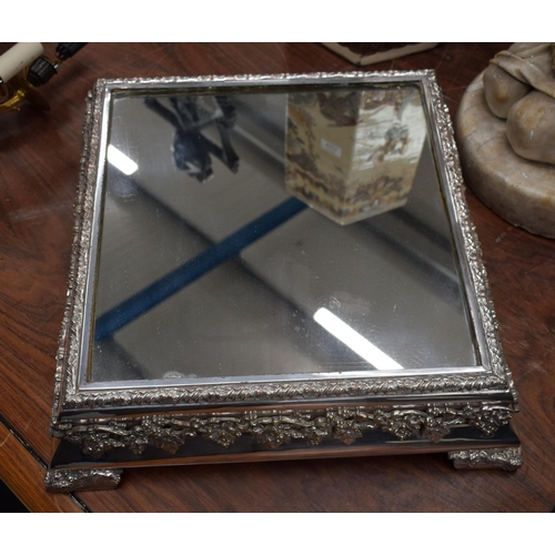 723L - A VERY LARGE EARLY 20TH CENTURY SILVER PLATED MIRRORED TABLE PLATTER. 48 cm square.