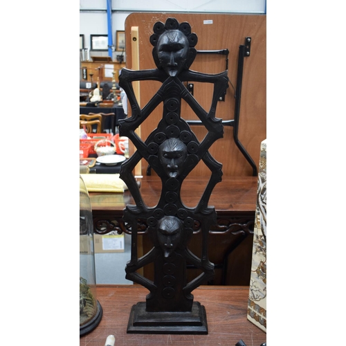 723G - A LARGE TRIBAL CARVED WOOD GROUP. 93 cm x 18 cm.