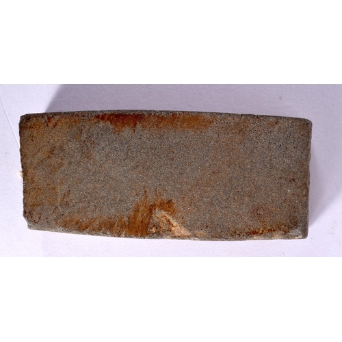 724 - A NATIVE AMERICAN KNIFE SHARPENING STONE.  8.2cm x 3.6cm x 1.1cm