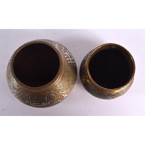 726 - TWO 19TH CENTURY MIDDLE EASTERN SILVER INLAID CENSERS decorated with calligraphy. Largest 11 cm wide... 