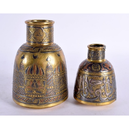 727 - A RARE 19TH CENTURY MIDDLE EASTERN SILVER INLAID BOTTLE NECK VASE decorated with buildings, together... 