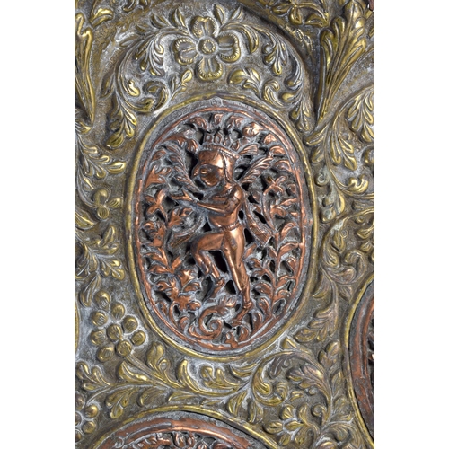 731 - A LARGE 19TH CENTURY MIDDLE EASTERN INDIAN MIXED METAL SCALLOPED CHARGER decorated with figures in v... 