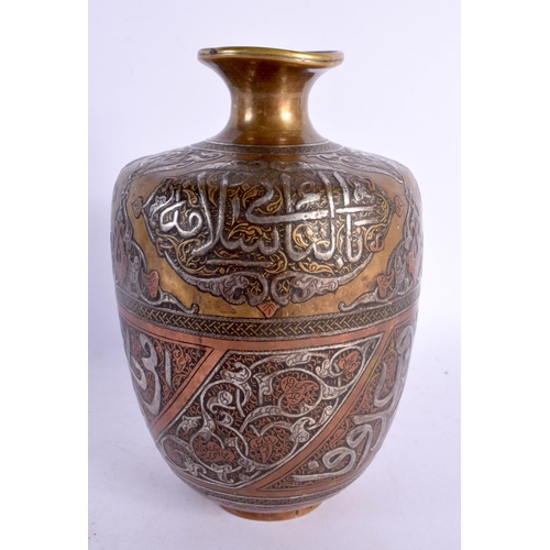 735 - A FINE 19TH CENTURY MIDDLE EASTERN SILVER INLAID BRONZE VASE decorated in mixed metals with scriptur... 