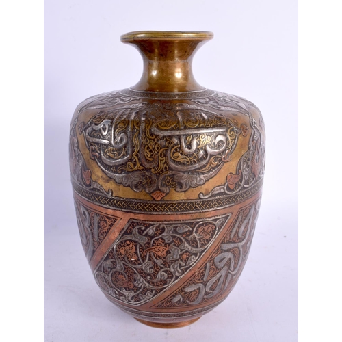 735 - A FINE 19TH CENTURY MIDDLE EASTERN SILVER INLAID BRONZE VASE decorated in mixed metals with scriptur... 