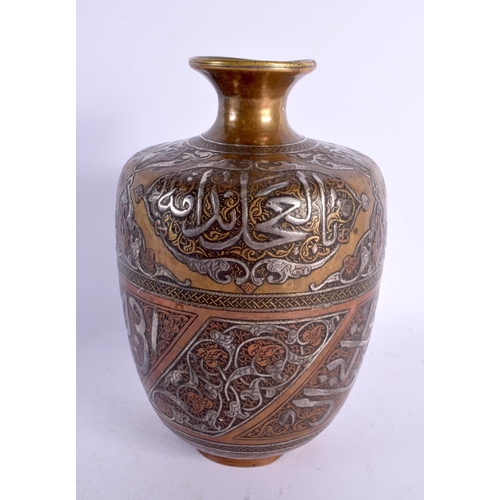 735 - A FINE 19TH CENTURY MIDDLE EASTERN SILVER INLAID BRONZE VASE decorated in mixed metals with scriptur... 