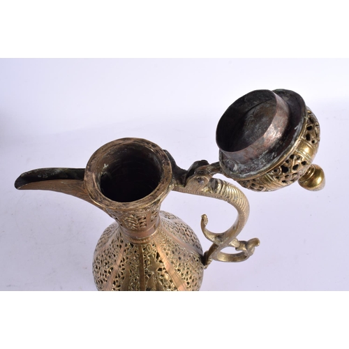 747 - A LARGE 18TH CENTURY MIDDLE EASTERN OTTOMAN TYPE BRONZE EWER decorated all over with foliage and vin... 