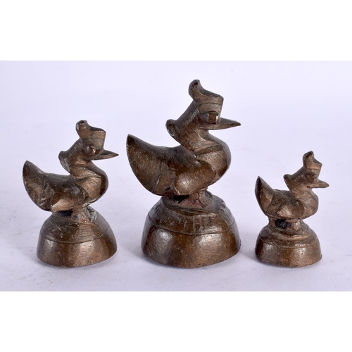 749C - THREE 19TH CENTURY INDIAN BRONZE OPIUM WEIGHTS. Largest 7 cm high. (3)