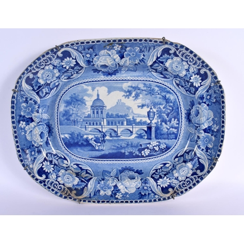 75 - A LARGE MID 19TH CENTURY BLUE AND WHITE RECTANGULAR MEAT DISH depicting figures before a building. 3... 