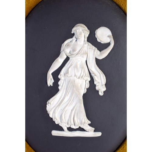 99 - A FRAMED WEDGWOOD BLACK BASALT CLASSICAL PLAQUE. 24 cm x 12 cm.