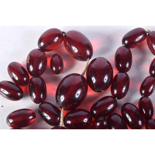 1008 - ASSORTED CHERRY AMBER TYPE BEADS. 51.5 grams. Largest bead 2.25 cm x 1.5 cm. (qty)