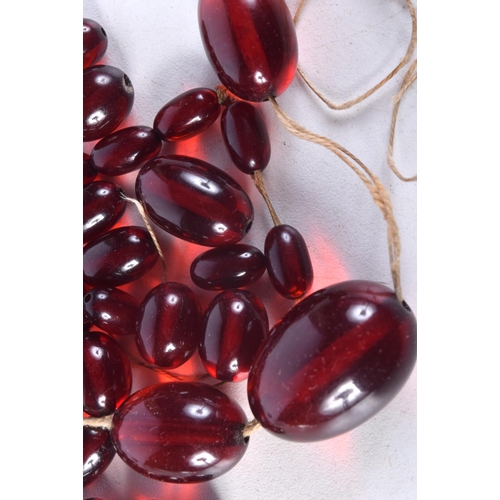 1008 - ASSORTED CHERRY AMBER TYPE BEADS. 51.5 grams. Largest bead 2.25 cm x 1.5 cm. (qty)