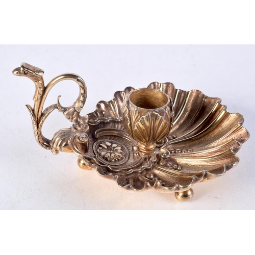 1023 - A CHARMING SILVER GILT CHAMBERSTICK. 276 grams. 12 cm wide.