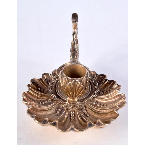 1023 - A CHARMING SILVER GILT CHAMBERSTICK. 276 grams. 12 cm wide.