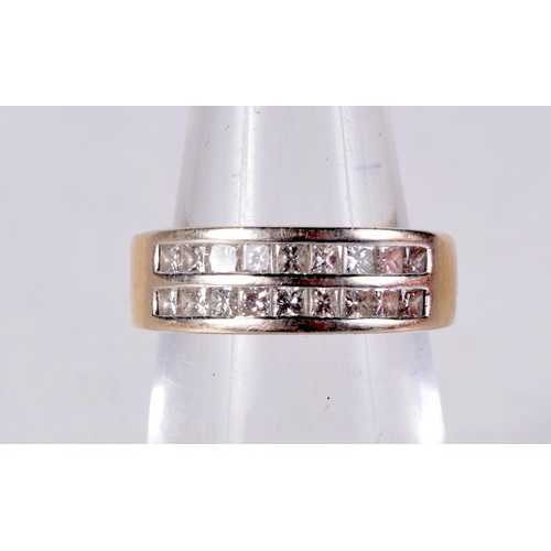 1026 - AN 18CT GOLD AND DIAMOND RING. J. 5.8 grams.