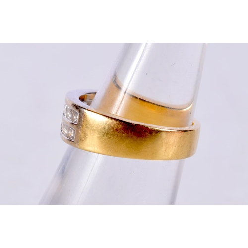 1026 - AN 18CT GOLD AND DIAMOND RING. J. 5.8 grams.