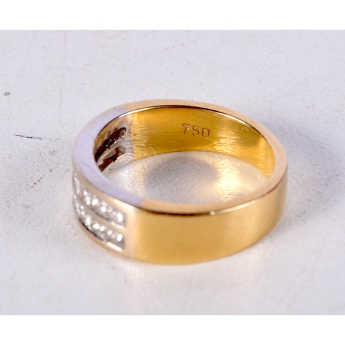 1026 - AN 18CT GOLD AND DIAMOND RING. J. 5.8 grams.