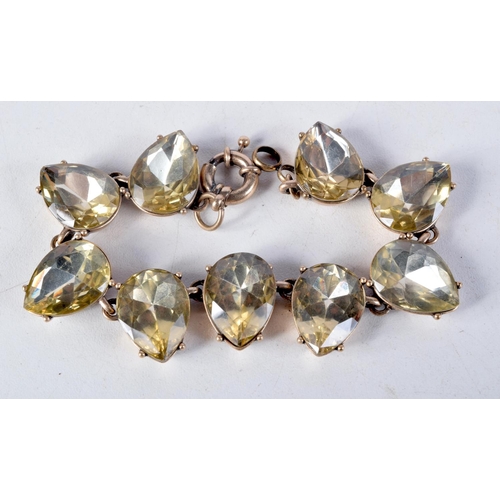 1033 - A LARGE ANTIQUE YELLOW METAL BRACELET possibly citrines. 39 grams. 15 cm long.