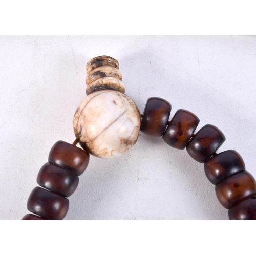 1055 - TWO MIDDLE EASTERN AMBER TYPE PRAYER BEAD NECKLACES. 198 grams. Longest 86 cm. (2)