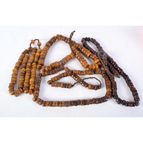 1059 - FOUR MIDDLE EASTERN AMBER TYPE PRAYER BEAD NECKLACES. 512 grams. Longest 92 cm. (4)