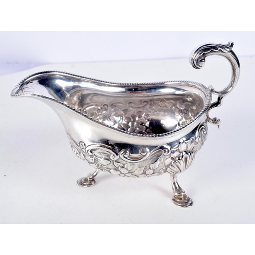 1067 - A LATE VICTORIAN SILVER REPOUSSE SAUCE BOAT by George & Nathan Ridley. Chester 1894. 268 grams. 18 c... 